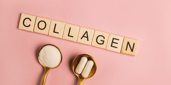 peach background with tiles spelling out collagen and spoons with capsules and collagen powder