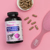 Primal Glow Beef Organ Nutrients Bottle on pink background and capsules